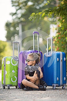 Beautiful young lady travelling with a suitcase
