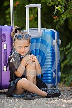 Beautiful young lady travelling with a suitcase