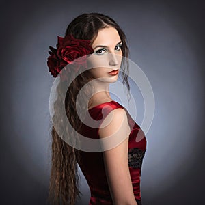 Beautiful young lady wearing red rose dress