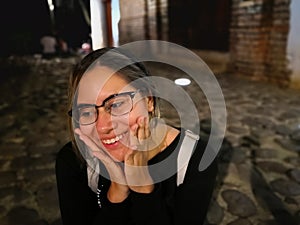 Beautiful young latina girl smiling with hands on her face and millennial style