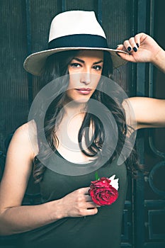 Beautiful young latino woman with panama hat portrait outdoor