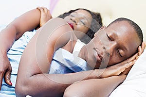 Beautiful young loving couple sleeping together