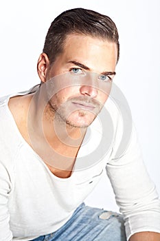 Beautiful young man against white background