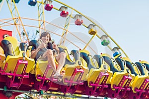 Beautiful, young man having fun at an amusement park