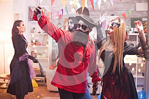 Beautiful young man and woman in halloween costumes