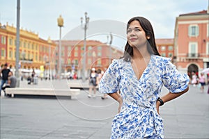 Beautiful young mixed race woman at Place Massena in Nice, France