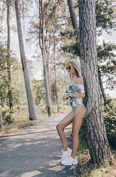 Beautiful young model in the street, wearing swimsuit. Fashion summer photo photo