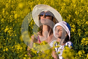 Beautiful young mother and her daughter relax