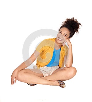 Beautiful young multi-racial woman sitting on floor