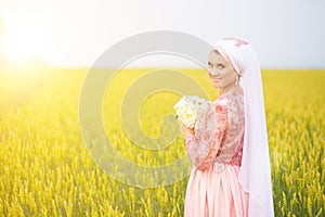 Beautiful young oriental bride preparing for wedding. Muslim marriage