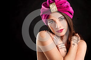 Beautiful young oriental woman in turban