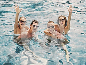 Beautiful Young People Having Fun in Swimming Pool