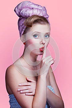 Beautiful young pin-up girl with surprised expression