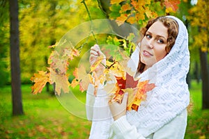 Beautiful young plussize model in the autumn park