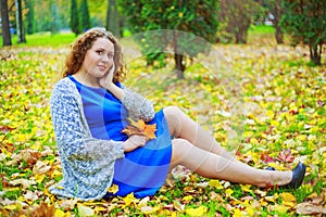 Plussize model in the autumn park photo