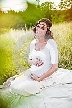 Beautiful young pregnant woman retouched