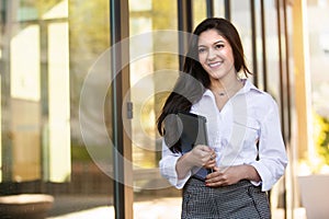 Beautiful young professional woman, financial business career, smiling confident and proud