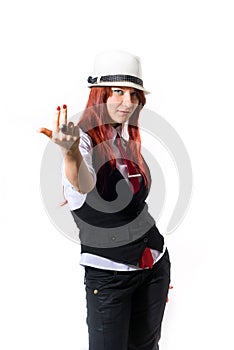 A beautiful young red-haired woman in a white hat on a white background, gestures to come to me