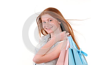 Beautiful young redhair woman with shoping bags photo