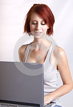 Beautiful young redhead woman sitting