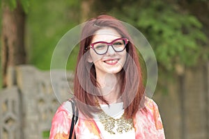 Beautiful young redhead woman smiling happily