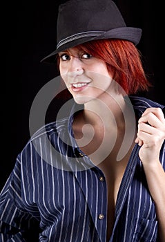 Beautiful young redhead woman wearing hat