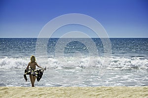 Beautiful young girl woman in bikini on the beach travel vacation healthy body and freedom concept