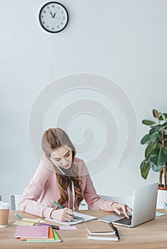 beautiful young student studying and using