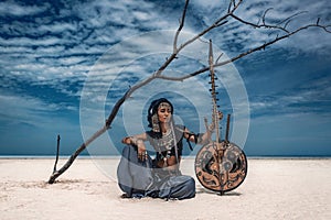 Beautiful young stylish tribal dancer. Woman in oriental costume