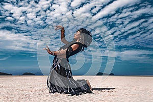 Beautiful young stylish tribal dancer. Woman in oriental costume