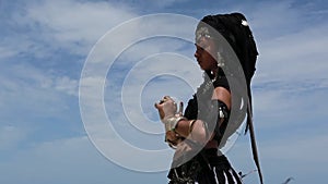 Beautiful young stylish tribal dancer. Woman in oriental costume dancing outdoors