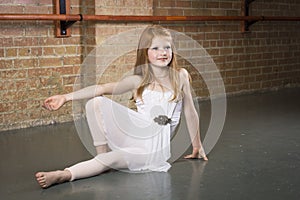 Beautiful young and talented dancer posing at a dance studio photo