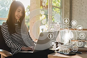 Beautiful young teenage woman freelance work with laptop at coffee shop, technology conceptual of IOT