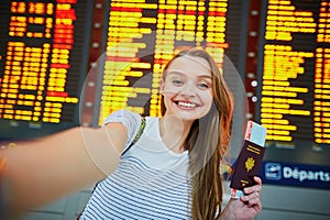 Beautiful young tourist girl in international airport