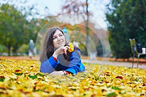 Beautiful young tourist in Paris on a fall day