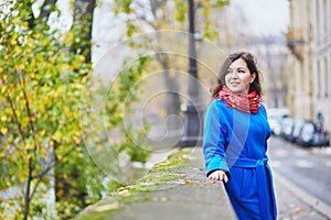 Beautiful young tourist in Paris on a fall day