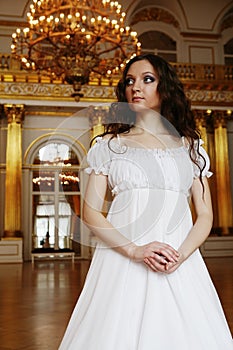Beautiful young victorian lady in white dress