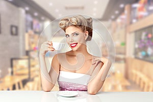 A beautiful young woman with a 1950s American-style hairstyle, joyfully sipping tea. Perfect for retro-themed concepts and
