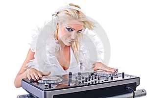 Beautiful Young Woman as DJ playing music on (pickup) mixer.