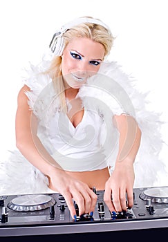 Beautiful Young Woman as DJ playing music on (pickup) mixer.