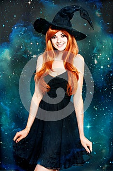 Beautiful young woman as halloween witch