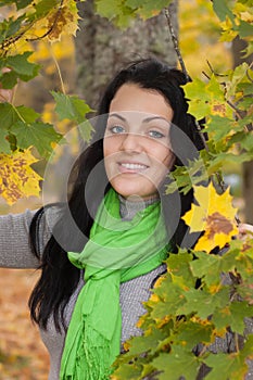 Beautiful young woman in autumn forest