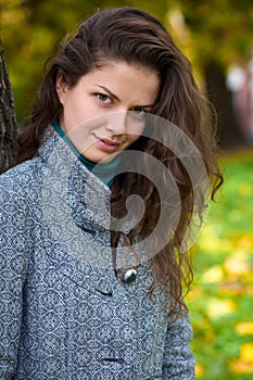 Beautiful young woman in a autumn park