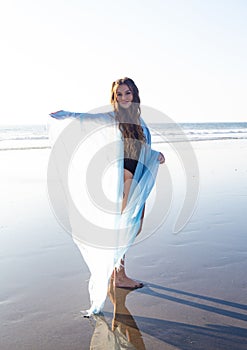 Beautiful young woman at the beach