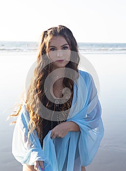 Beautiful young woman at the beach