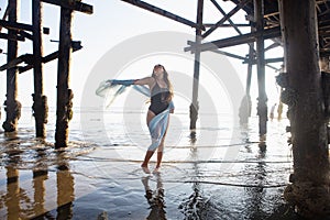 Beautiful young woman at the beach