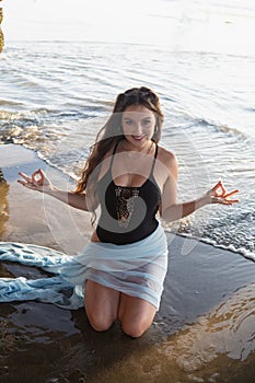 Beautiful young woman at the beach