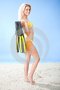 Beautiful young woman in bikini with snorkel