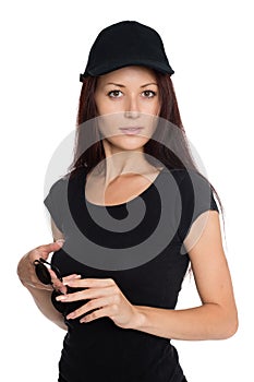 Beautiful young woman in a black baseball cap