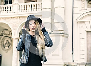 Beautiful young woman in black hat